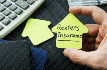 Hand holding a post-it note with text.